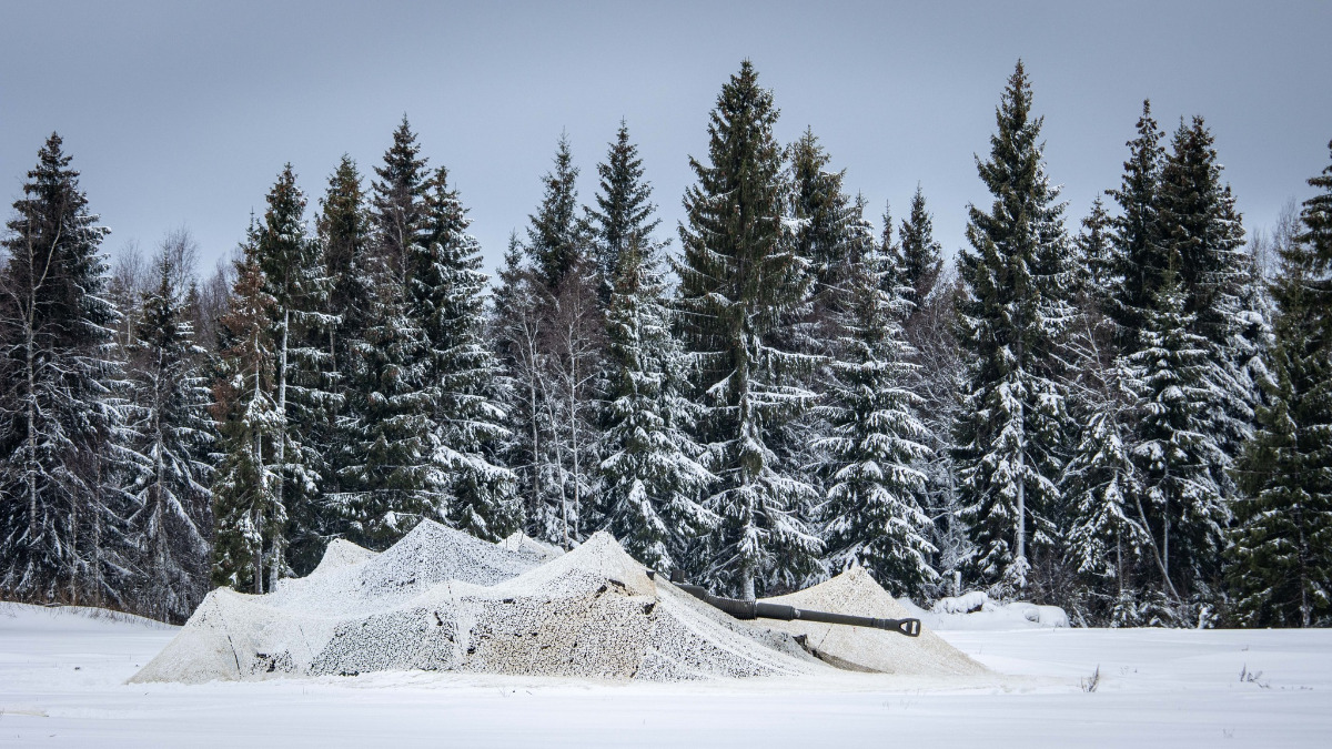 A camouflaged tank during exercise Winter Camp in Estonia