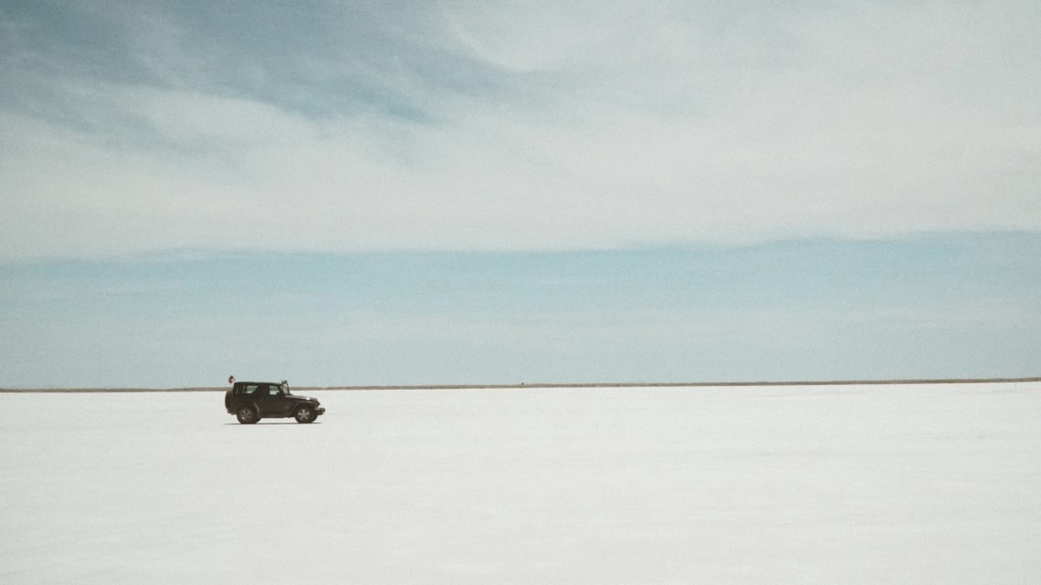 https://unsplash.com/photos/a-car-driving-on-a-snowy-road-NWx3Kdw54zQ